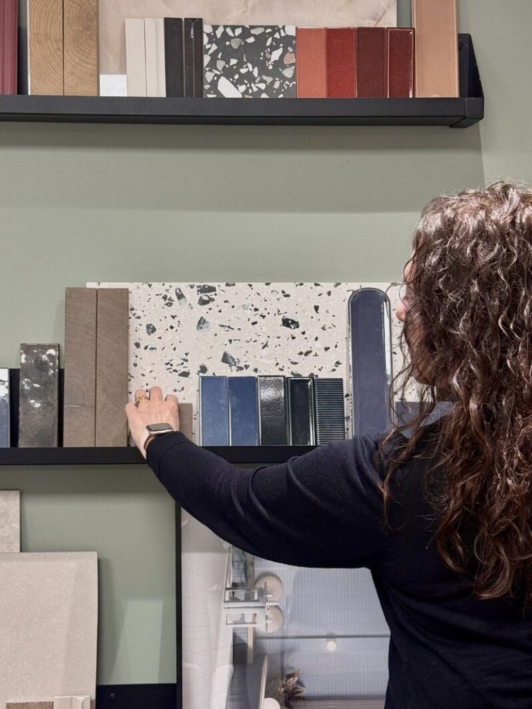 Julie organising the mood board of ceramic tiles.